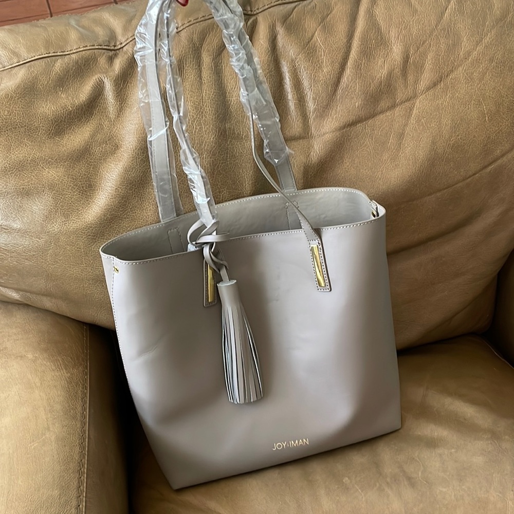 Brand new Joy & Iman mauve purse